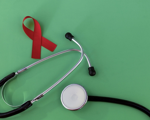 HIV red ribbon and stethoscope