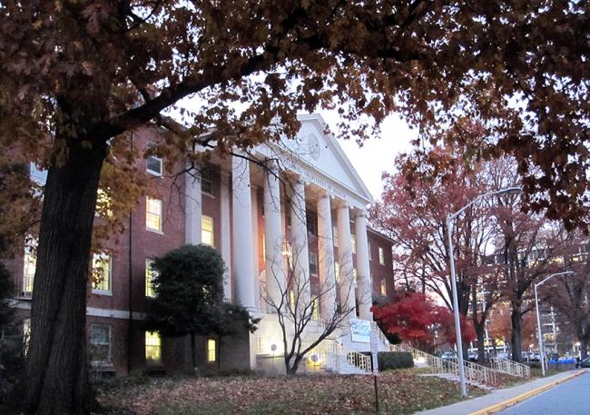 A brick building with a pillared entrance at the National Institutes of Health 