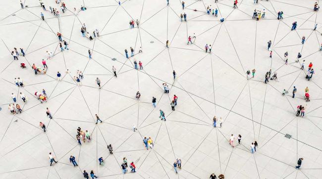 Overhead shot of people with lines connecting them to form a web